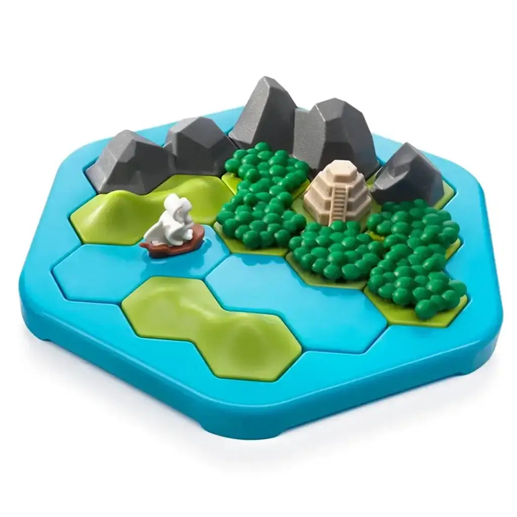 Close-up of Smart Games Treasure Island puzzle board showing a sailboat on blue water, green forests, gray mountains, and a beige temple hidden among the landscape pieces.