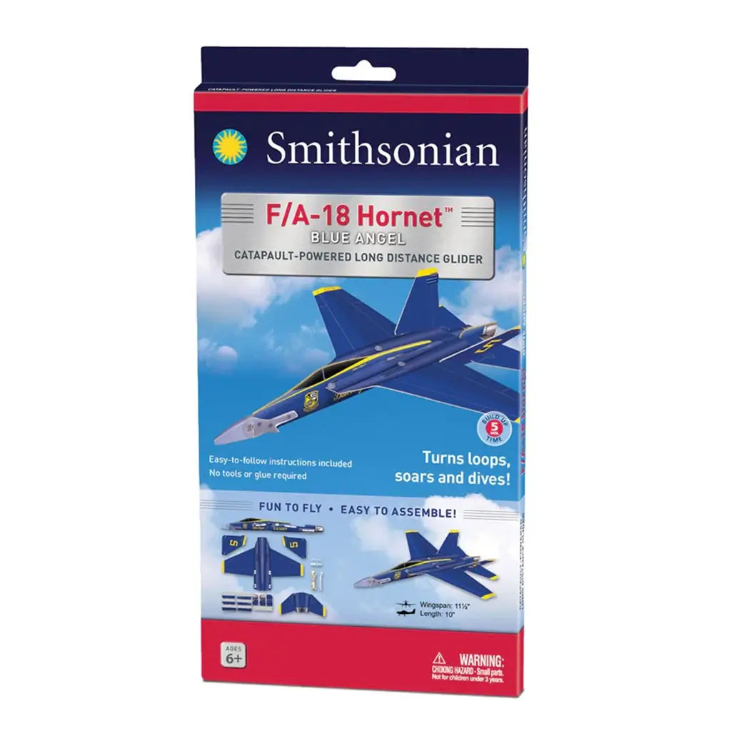 Smithsonian F/A-18 Hornet Blue Angels glider packaging shows the blue foam aircraft against a bright sky backdrop with diagrams and labels highlighting long-distance catapult-powered flight for young aviation enthusiasts.