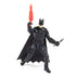 Batman action figure in black armor holds red grappling gun in one hand and black bat-shaped batarang in other, posed in heroic stance with flowing cape.