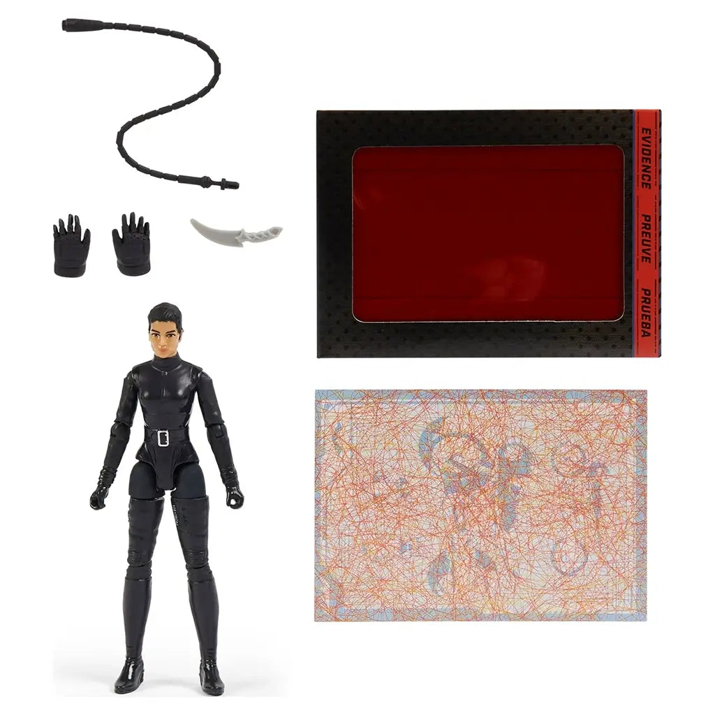 Selina Kyle action figure in black suit shown with whip, gloves, knife, red decoder card, and mystery map accessory, laid out neatly against white background.