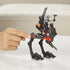 Close-up of the Star Wars Mission Fleet AT-RT walker toy featuring a gray and red repositionable projectile launcher with a Tech Bad Batch figure seated in the cockpit, ready for action play.