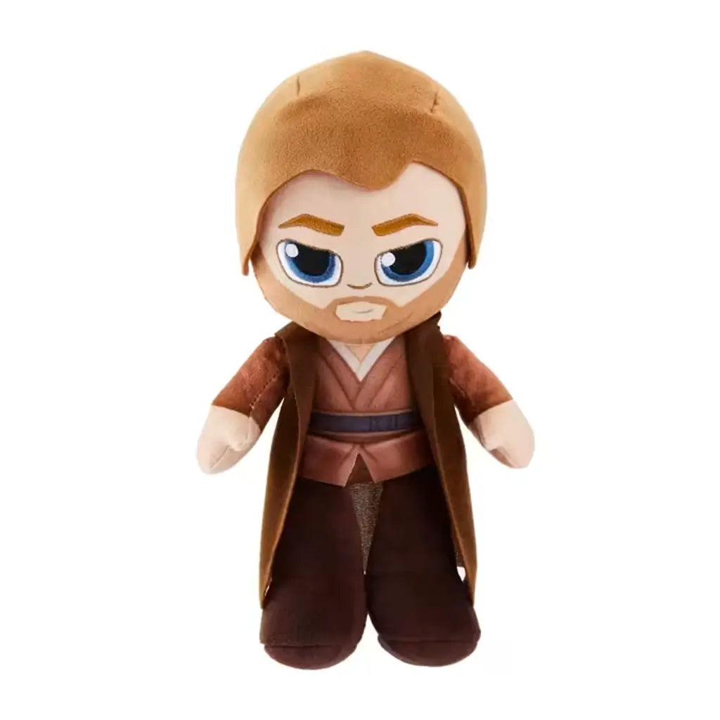 Star Wars Obi-Wan Kenobi plush figure in soft brown Jedi robe and tunic, standing upright with embroidered face and oversized expressive blue eyes.