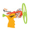 Toy stunt flyer launcher displays bright yellow molded handle, orange and white patterned airplane body and wide green rotor ring designed for energetic outdoor flight on a clean white backdrop.