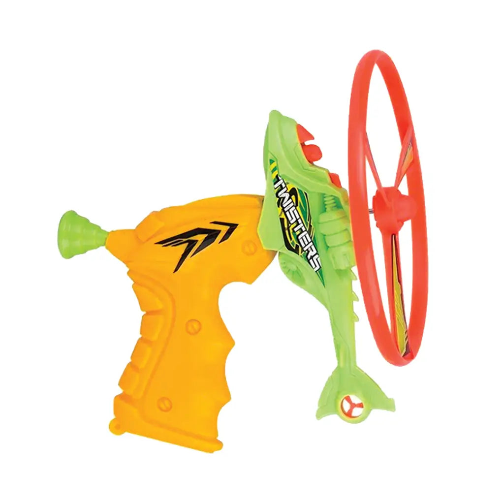 Toy stunt flyer launcher features bright yellow plastic grip handle, green textured helicopter body and large red circular rotor for high-flying outdoor play shown against a plain white background.