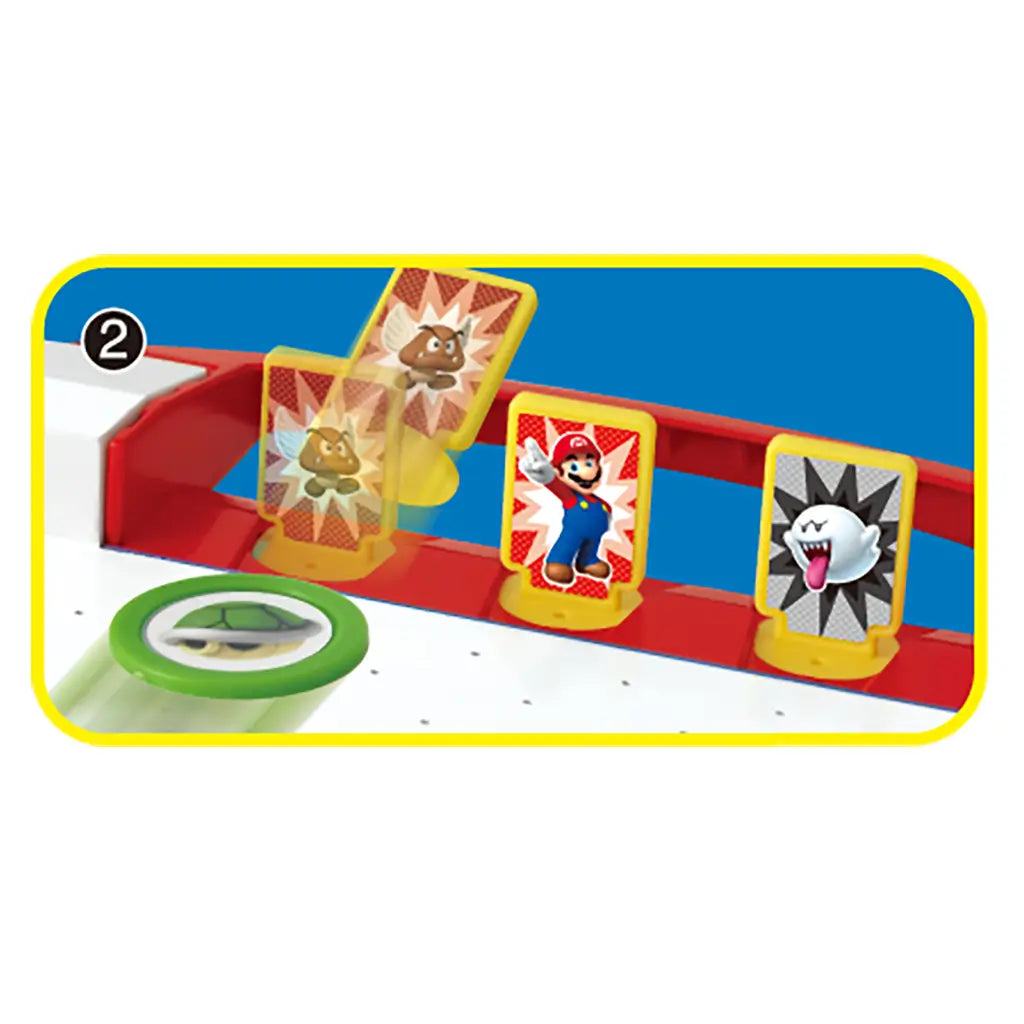 Close-up of yellow game cards featuring Mario, Goomba, and Boo characters from Super Mario, displayed on the air hockey table with a green puck nearby.