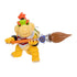 Super Mario Galaxy Movie Bowser Jr. figure is yellow plastic with green and orange details, posed gripping a large orange-handled paintbrush horizontally on white.