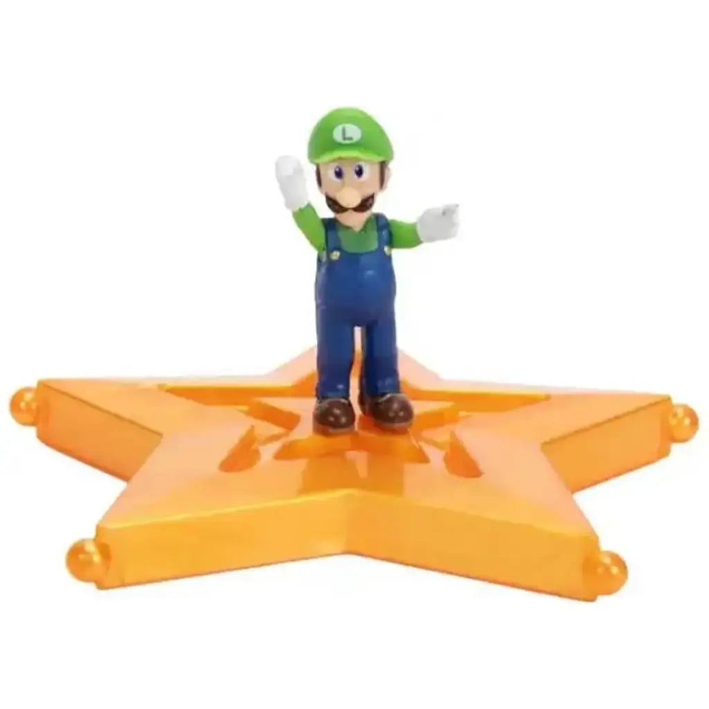 Super Mario Galaxy Movie Luigi figure wears green and blue overalls with white gloves and brown shoes, posed with both arms raised on a glossy orange-gold star platform.