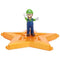 Super Mario Galaxy Movie Luigi figure wears green and blue overalls with white gloves and brown shoes, posed with both arms raised on a glossy orange-gold star platform.