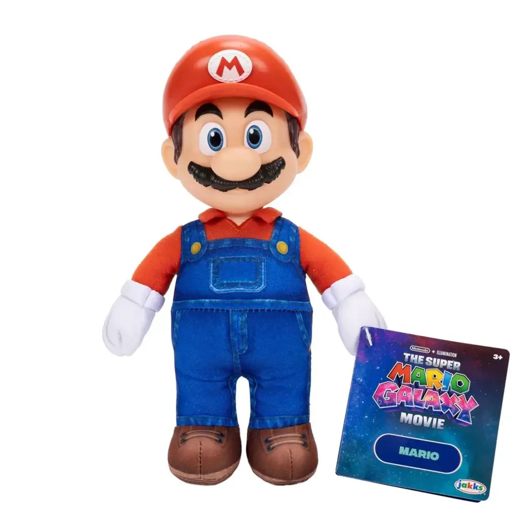 Mario plush toy from The Super Mario Galaxy Movie features soft red and blue fabric, blue overalls, white gloves, brown shoes, red M cap, black mustache, and retail tag.