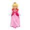 Princess Peach plush toy from The Super Mario Galaxy Movie wears a soft pink satin gown with darker pink panels, white gloves, blonde hair, jeweled gold crown, and blue accents.
