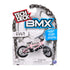 Tech Deck BMX toy packaging in white cardboard and clear plastic blister, rounded top form with chain graphic border, displaying pink FULT BMX bike, bold branding, age label, and safety warning on a clean background.