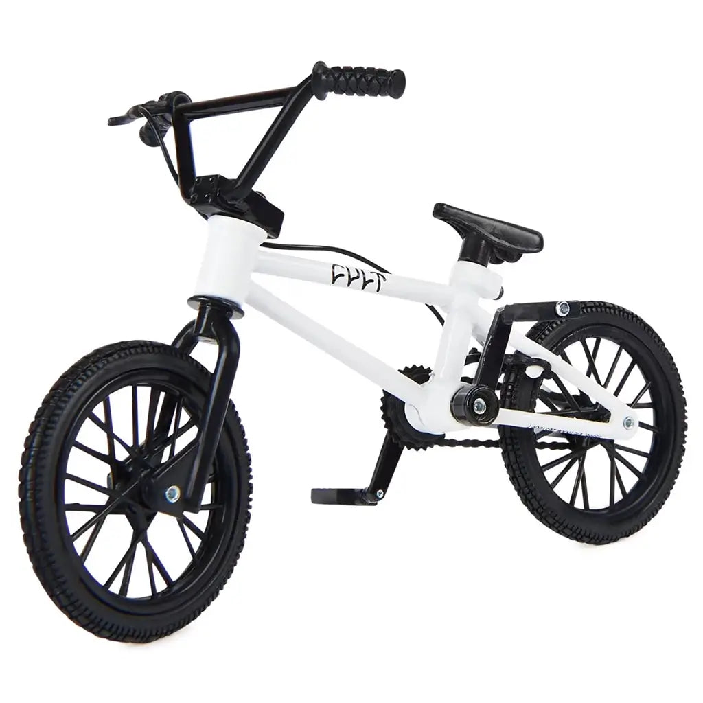 Tech Deck BMX finger bike in white and black metal and plastic, compact stunt frame with spoked wheels, pegs, and handlebars, designed for freestyle tricks on a clean white studio background.