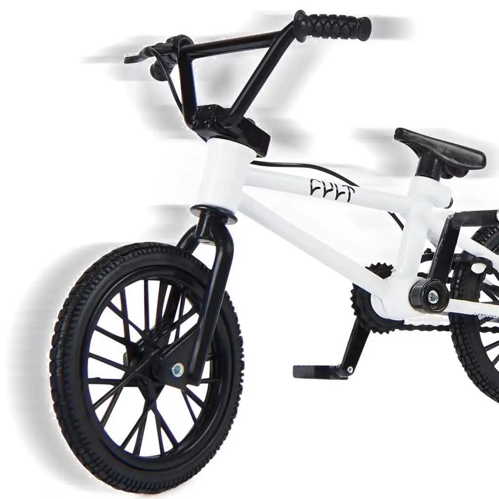 Tech Deck BMX finger bike close-up in white metal frame with black rubber tires and textured grips, detailed compact stunt design with pedals and chain, shown on a minimal white background.
