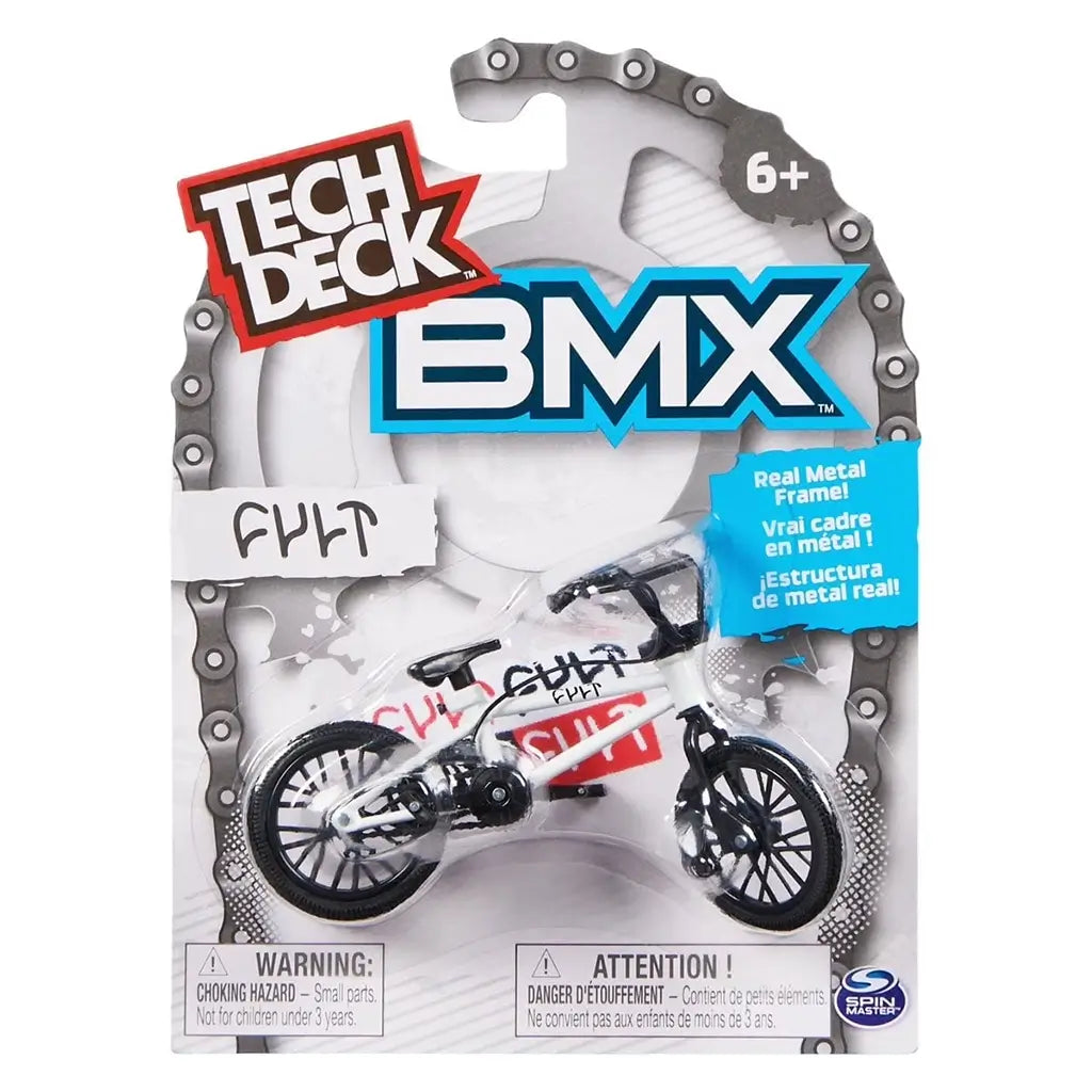 Tech Deck BMX toy packaging in white cardboard and clear plastic blister, rounded chain-style border displaying white FULT BMX bike, bold branding, age label, and safety warnings on a clean background.