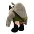 Rear angled view of Rocksteady plush figure from Teenage Mutant Ninja Turtles, gray rhino in green vest and camo pants, with fabric tag visible on back seam.