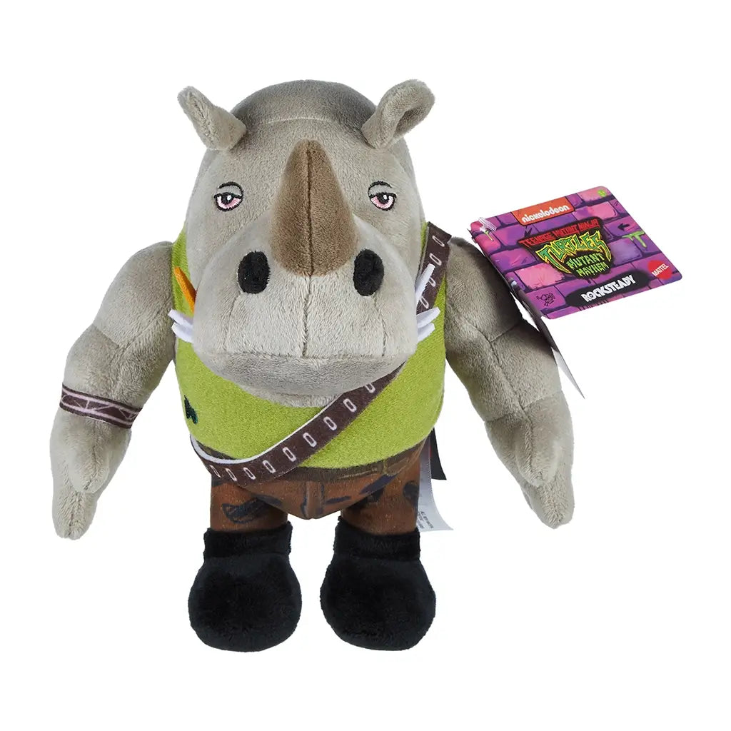 Teenage Mutant Ninja Turtles Rocksteady plush toy, gray rhino with soft fabric texture, green vest, camo pants, and black boots, shown with attached Nickelodeon tag.