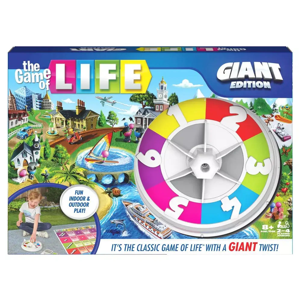Front of The Game of Life Giant Edition box with bright artwork, a large spinner, and a child shown playing on the oversized mat, emphasizing fun for all ages.