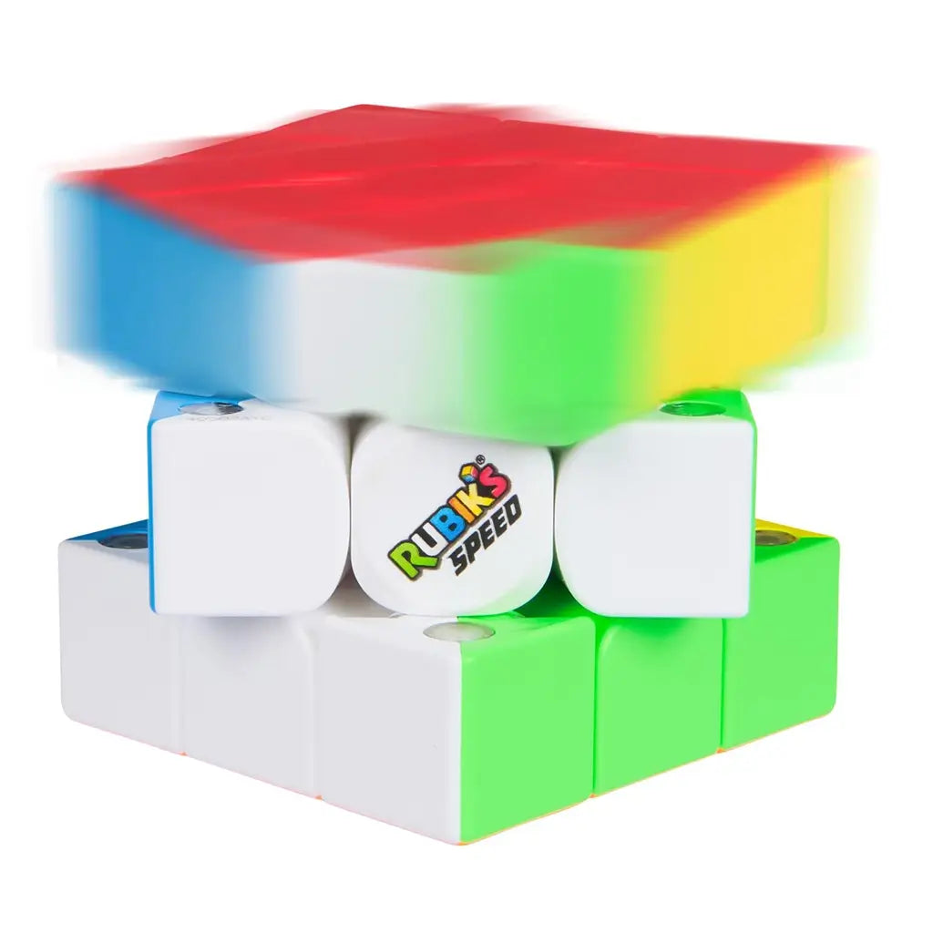 Rubik’s Speed Cube 3x3 puzzle in multicolor plastic with smooth tiles, dynamic motion blur showing fast rotation of top layer, compact cube shape designed for speed solving on white background.