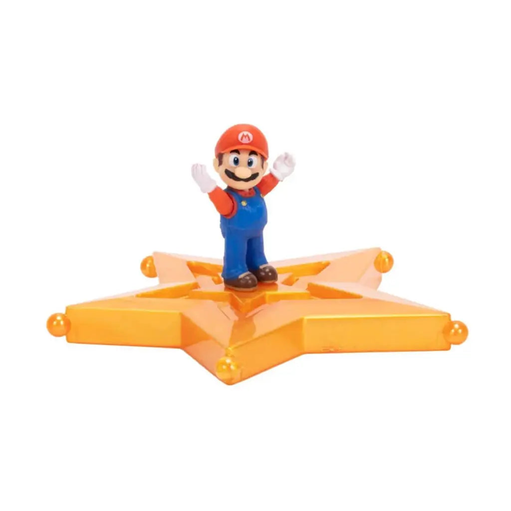 Super Mario Galaxy Mario figure in red and blue plastic with rounded form and raised arms pose, standing on translucent orange star platform, designed for collectible display on a white backdrop