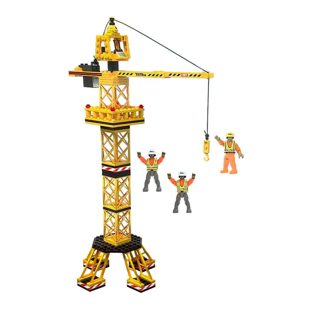Tonka yellow construction crane toy with a tall lattice tower, working hook and cable, sturdy black-and-yellow base, and three construction worker figures in helmets and orange safety gear.