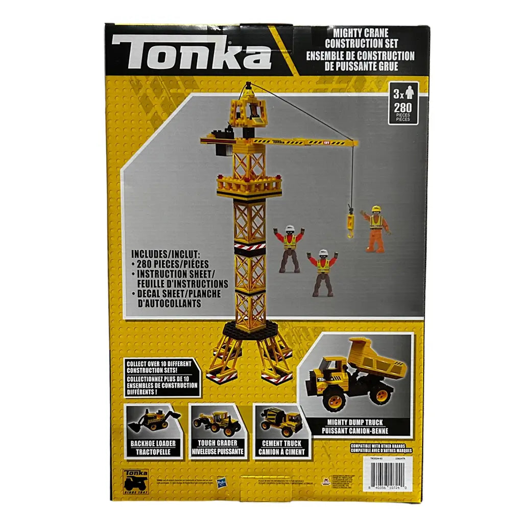 Back of Tonka Mighty Crane Construction Set box showing crane assembly details, accessories, mini workers, and compatible construction vehicles like dump and cement trucks for creative construction play.
