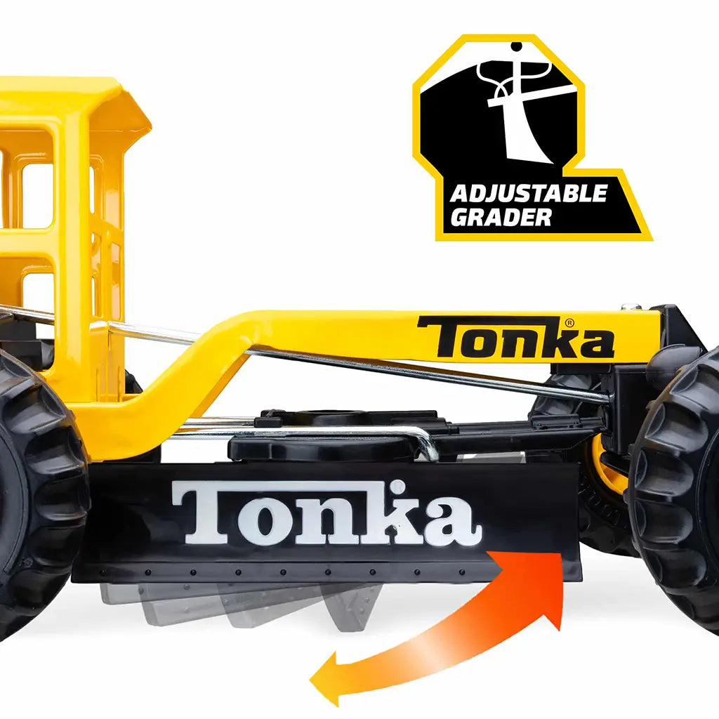Close-up of Tonka grader’s adjustable black front blade with orange arrow graphic showing movement, highlighting its interactive play function.