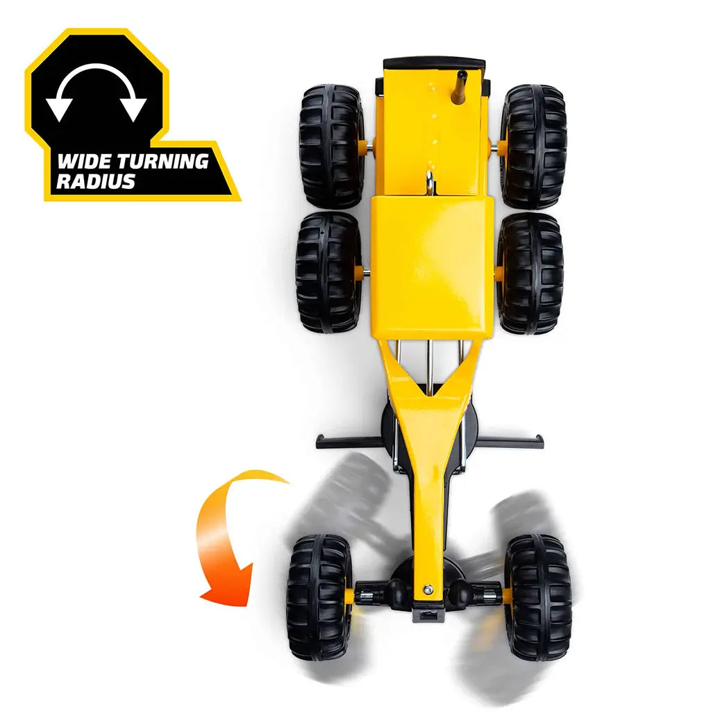 Top-down view of yellow Tonka grader showing wide turning radius with orange curved arrow and labeled icon on white background.