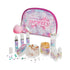 Toy Box “Feeling Pretty” spa craft kit with shimmering pink and purple pouch, small bottles of essential oils, shimmer lotion, and salt scrub ingredients arranged for a fun DIY beauty project.
