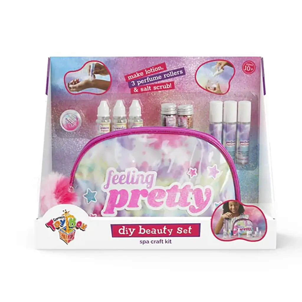Toy Box “Feeling Pretty” DIY Beauty Set packaging featuring a glittery pink and purple pouch, mini bottles, and tools for making lotion, perfume rollers, and salt scrub, aimed at creative self-care play.