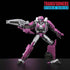 Transformers Elita-1 pink and silver articulated action figure with detailed armor panels, angular limbs and a large rifle posed dynamically on a dark studio background.