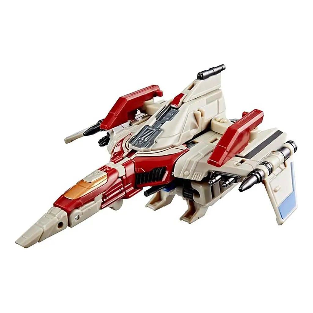 Transformers ONE Starscream shown in Cybertronian Tetra Jet mode with sleek beige hull, red wings, silver thrusters, and angular cockpit detailing highlighting aerodynamic sci-fi vehicle styling.
