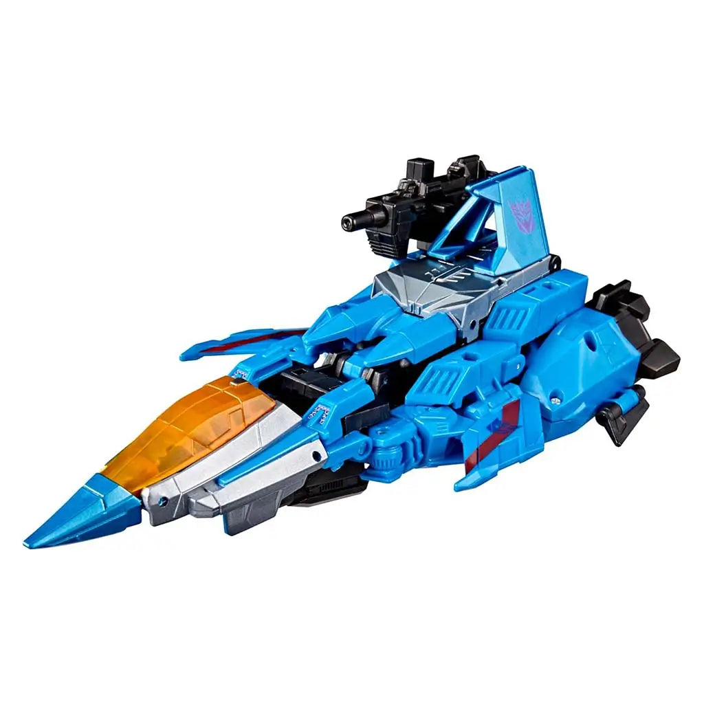 Transformers Thundercracker transformed into sleek tetra jet mode with angular blue panels, amber cockpit, silver nosecone highlights, and a mounted black cannon on a white backdrop.
