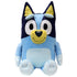 Bluey plush toy in light and dark blue soft fabric with cream muzzle and inner ears, upright seated form with rounded limbs, large oval eyes and smiling face, cuddly plush isolated on white background