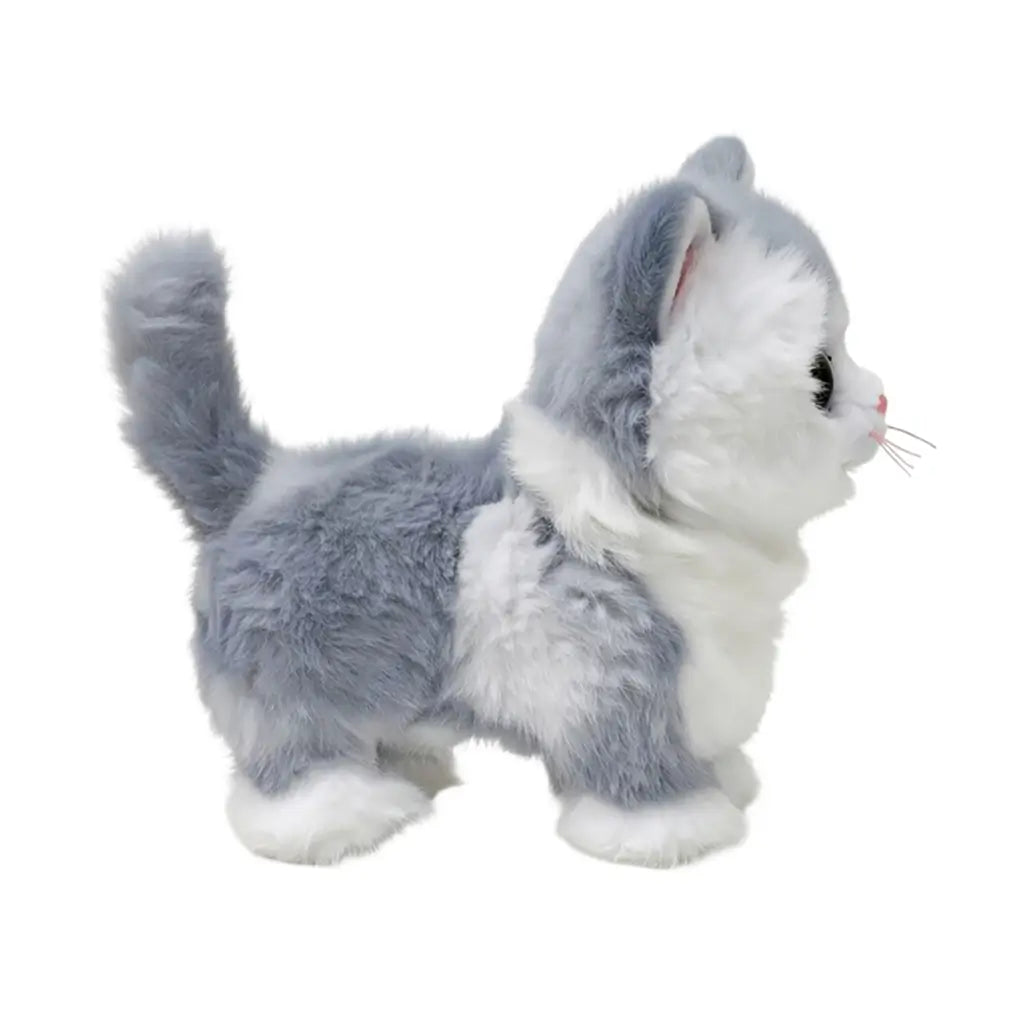 Ty Beanie Babies Furley gray cat plush toy in gray and white soft faux fur with small standing kitten form, featuring raised tail, side profile, fluffy texture, and stitched facial details on backdrop.