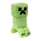 Minecraft Creeper plush toy in bright green soft fabric with blocky pixel-style shape, featuring square head, black pixel face, short legs, and minimalist design, on a plain white background.