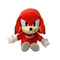 Sonic Knuckles plush toy in bright red soft fabric with rounded cartoon shape, featuring stitched eyes, cream muzzle, white gloves and multicolor shoes, designed as a collectible character doll on a white background.