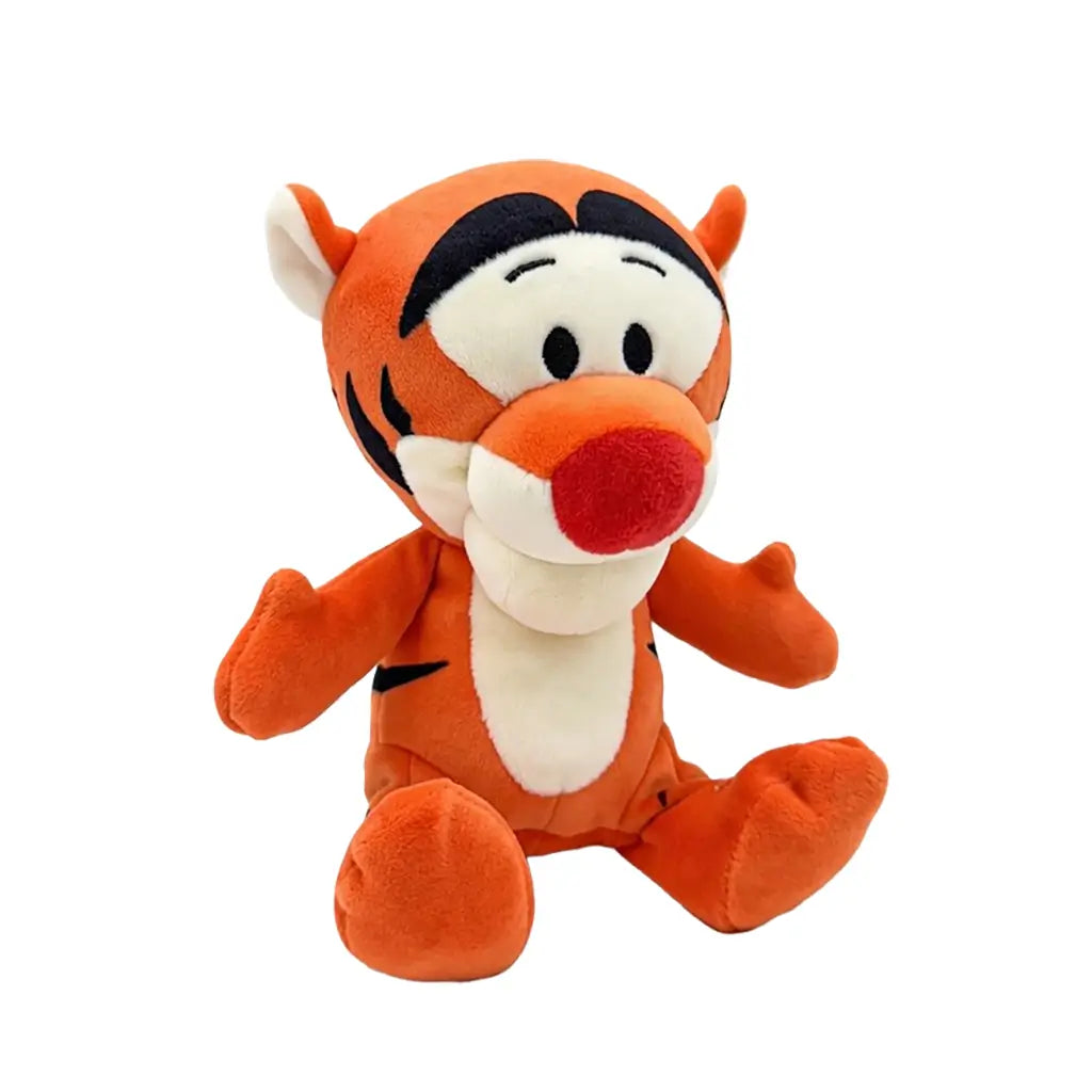 Disney Tigger plush toy in bright orange soft fabric with rounded tiger shape, shown at an angled view with black stripes, cream muzzle and belly, red nose, and stitched eyes, on a white background.
