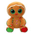 Brown gingerbread man plush toy with glittery green eyes, red nose, candy cane striped trim, and peppermint button details, designed as a festive Ty Beanie Boos holiday collectible.