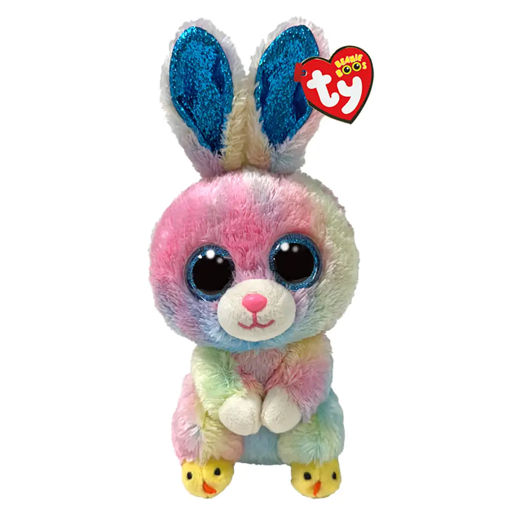Ty Beanie Boos Twitches rabbit plush toy in pastel multicolor fuzzy fabric with rounded soft body shape, featuring large blue glitter eyes, pink nose, long upright ears with blue glitter lining, and small yellow chick-themed feet on a white background.