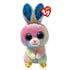 Ty Beanie Boos Twitches rabbit plush toy in pastel multicolor fuzzy fabric with rounded soft body shape, featuring large blue glitter eyes, pink nose, long upright ears with blue glitter lining, and small yellow chick-themed feet on a white background.