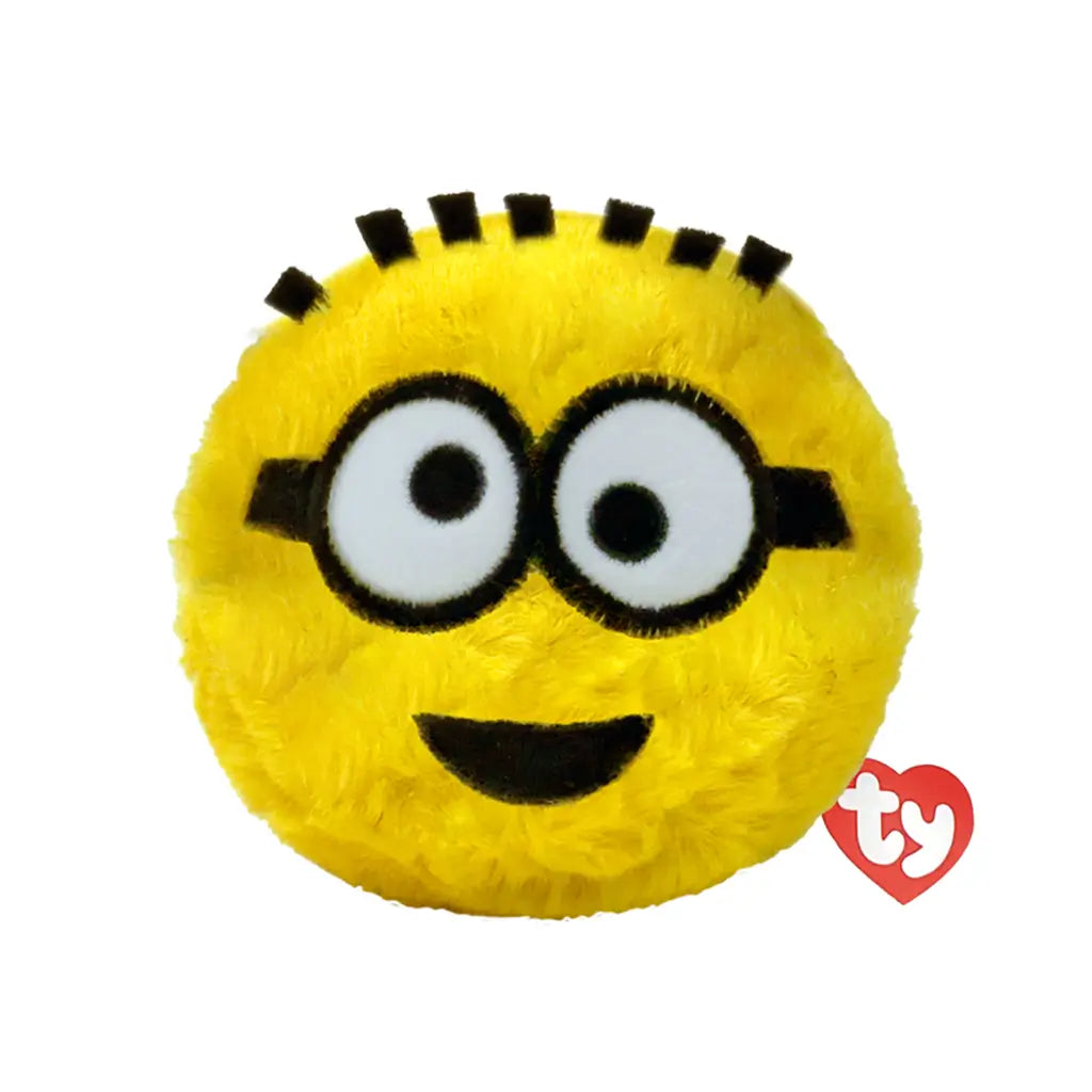 Minions Phil plush toy in bright yellow soft fabric with black goggle strap and round goggles, rounded ball shape, smiling face with wide eyes and small mouth, bounceable plush on white background