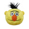 Sesame Street Bert plush toy features pale yellow fuzzy fabric, round soft cushion face shape, large white and black eyes with bold brow, orange oval nose, subtle stitched smile, and short spiky black hair on a plain white background