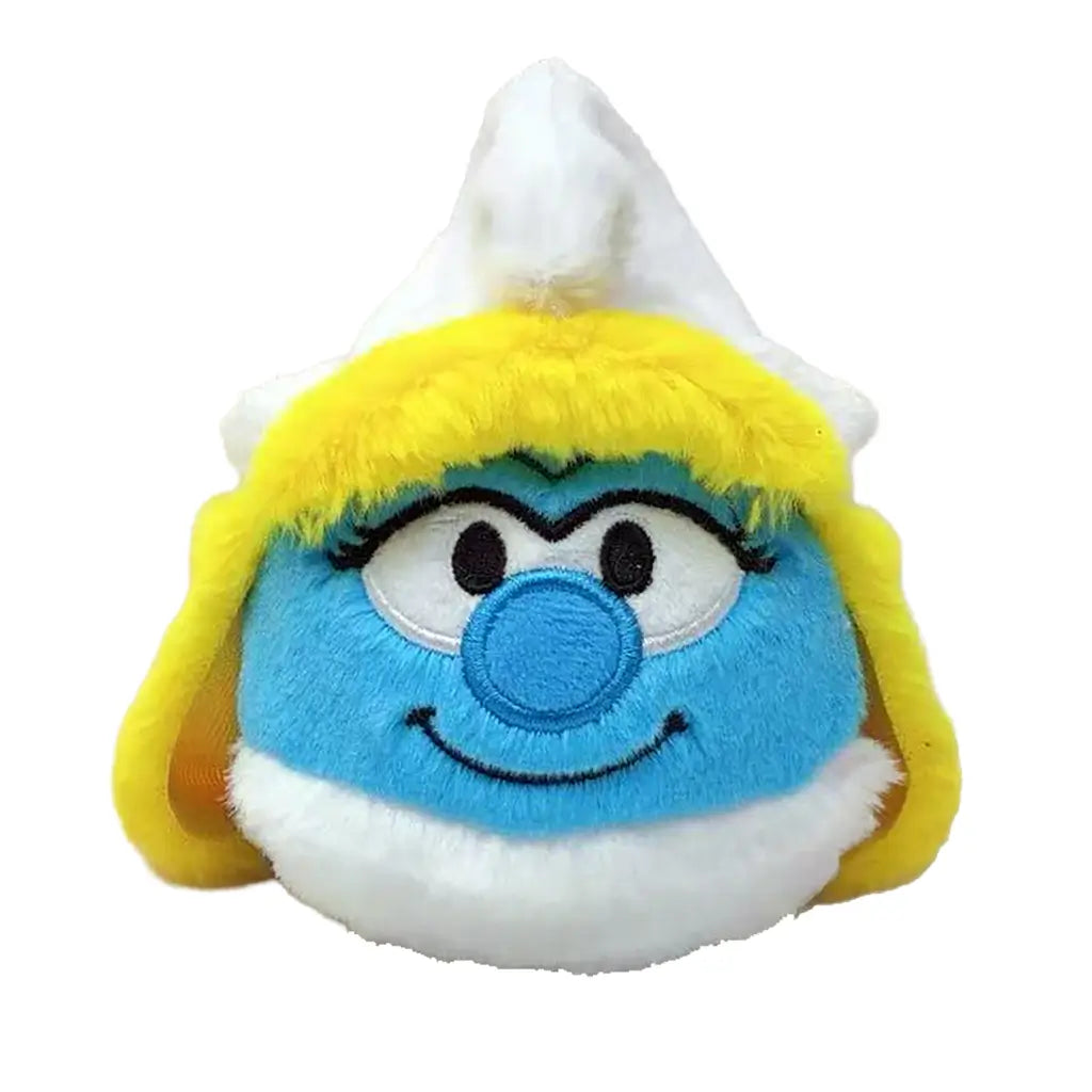 Smurfette plush toy Ty Beanie Bouncers in blue, yellow, and white soft fabric, round character face with yellow hair, white hat, embroidered eyes and smile, bouncer ball design on white background.