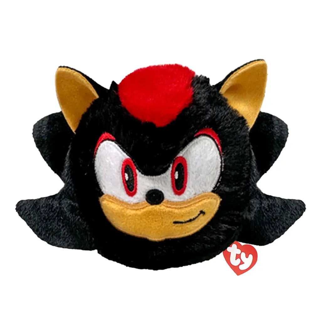 Sonic the Hedgehog Shadow plush toy in black and red soft fabric with tan muzzle and inner ears, rounded ball shape, red eyes and confident smile, bounceable plush isolated on white background