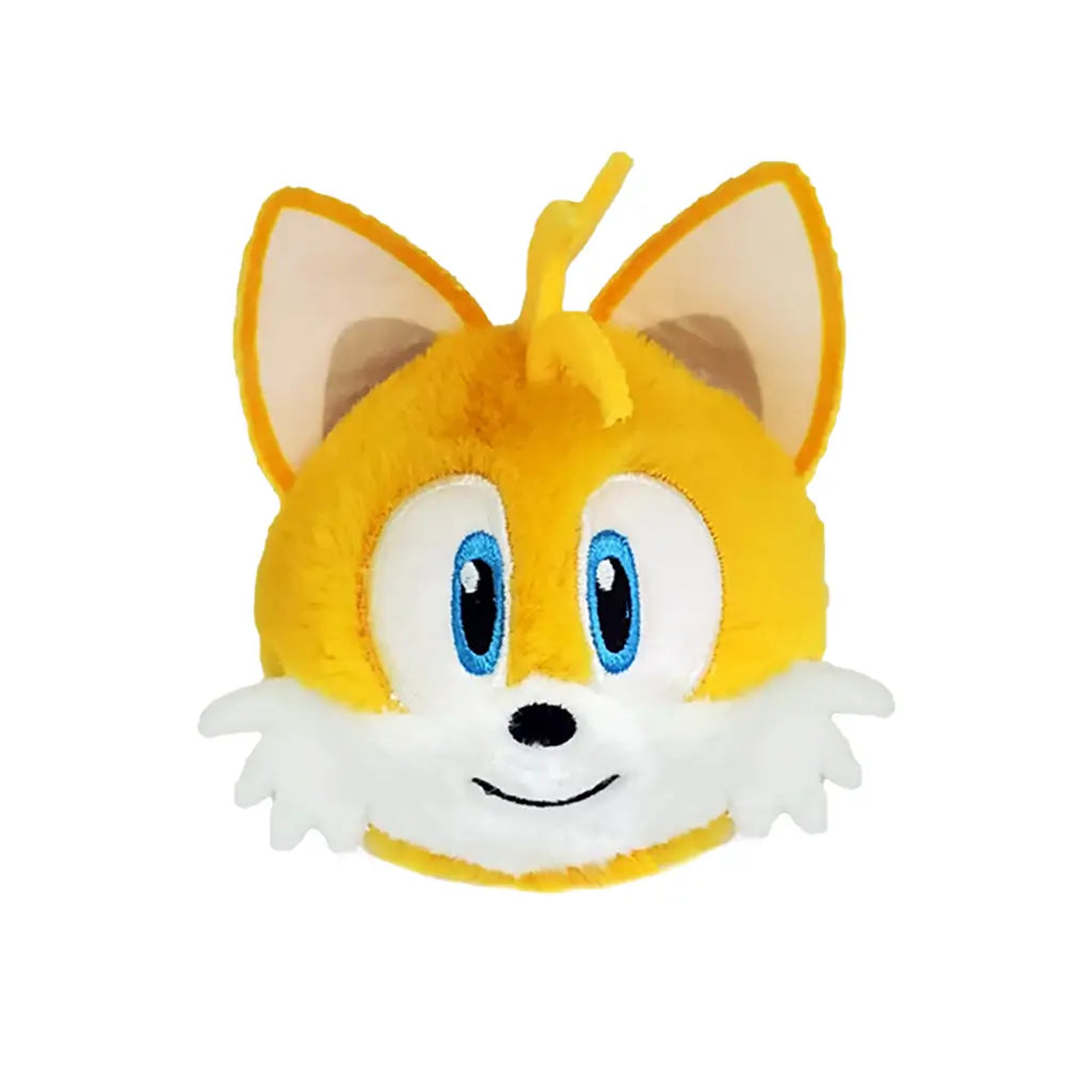 Sonic the Hedgehog Tails plush toy in bright yellow and white soft fabric with large ears and blue eyes, rounded ball shape, smiling face with small nose and fluffy cheeks, bounceable plush on white