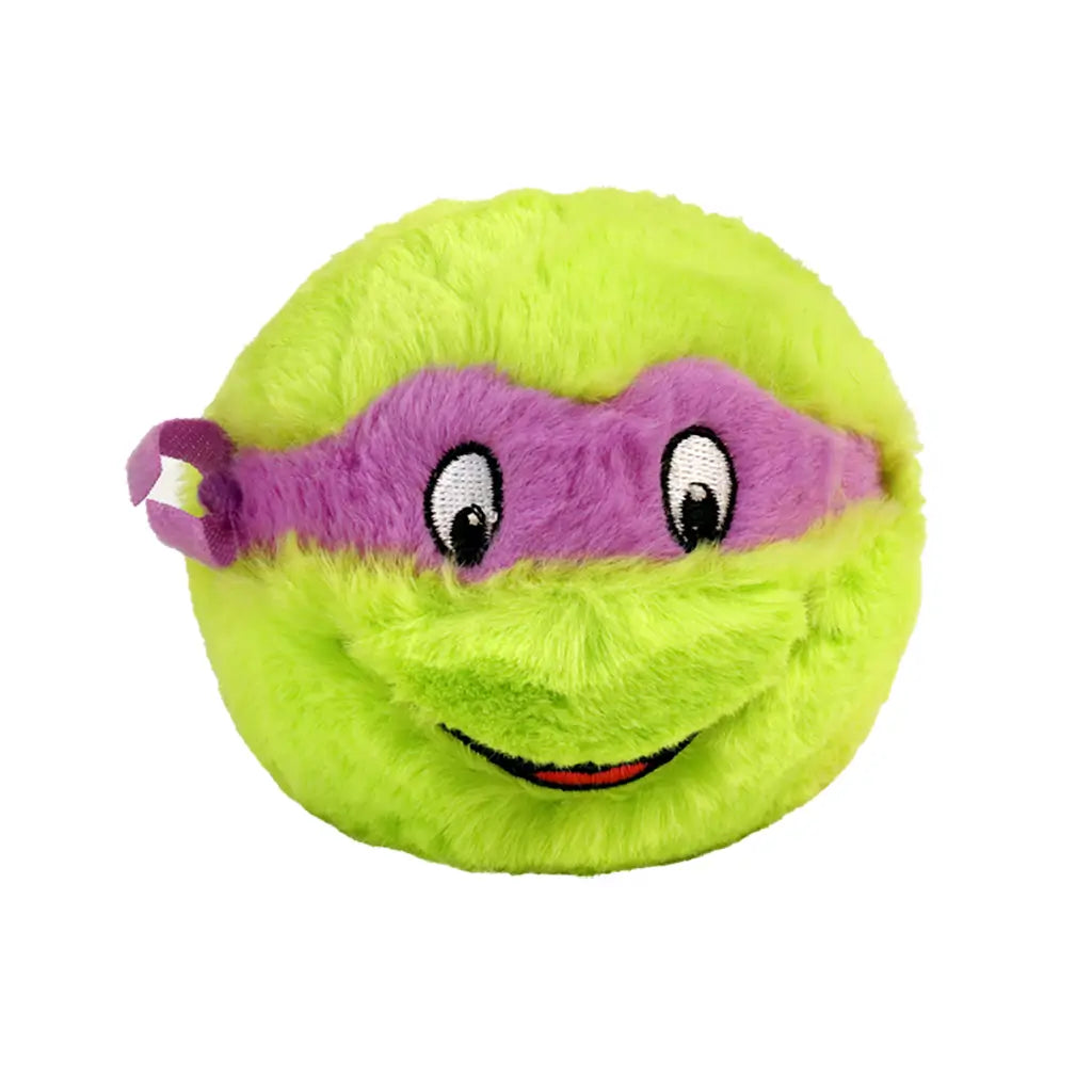 TY Beanie Bouncers Donatello plush toy, bright green fuzzy sphere with soft texture and purple eye mask, rounded bouncer shape with embroidered eyes and smile, character design on a light background.