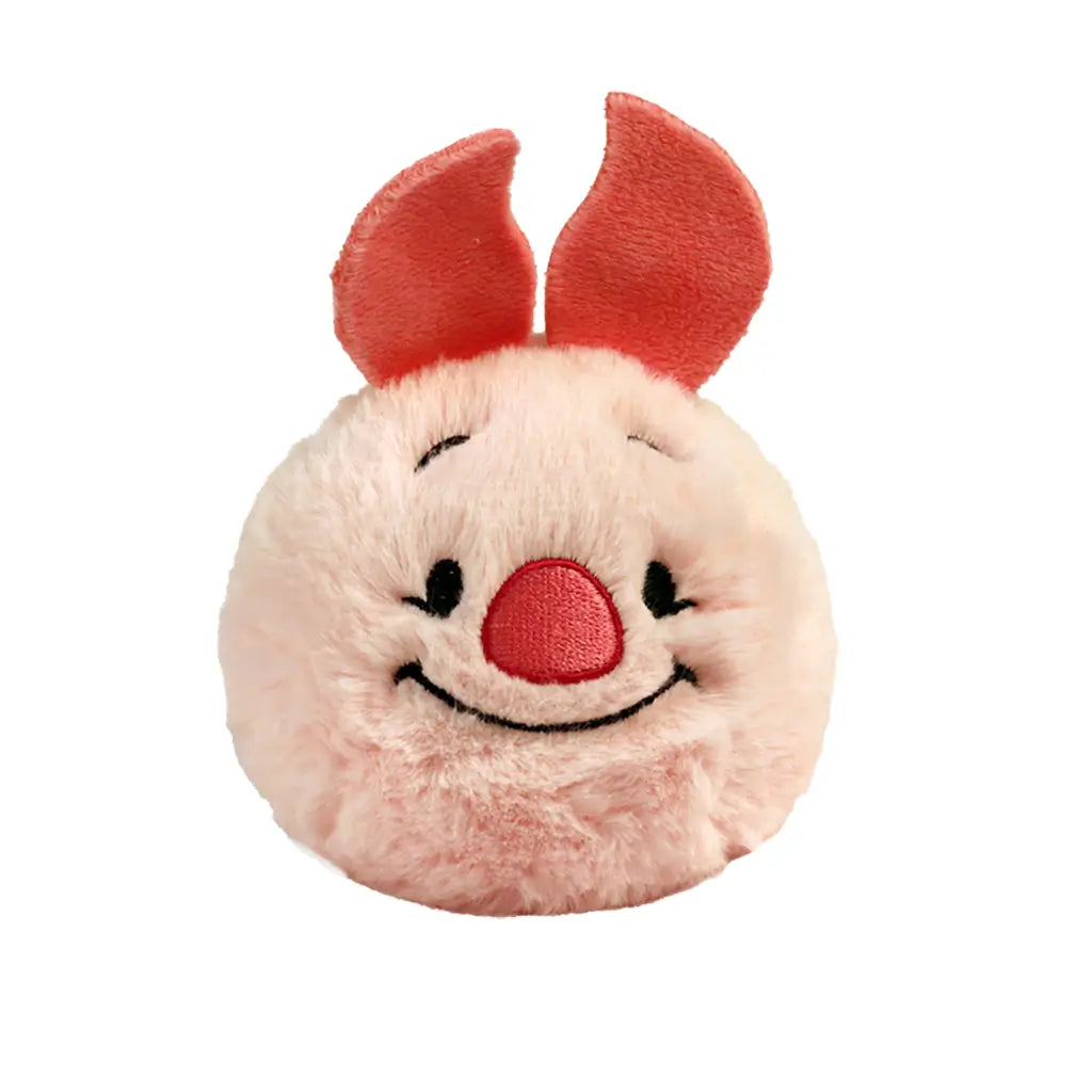Disney Piglet plush toy in soft pale pink fabric with darker pink ears, rounded ball shape, smiling embroidered face with small eyes and red nose, bounceable plush design, isolated on white background