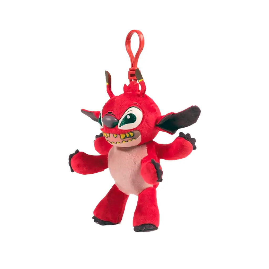 Disney Leroy plush keychain clip toy in bright red soft fabric with rounded alien body, angled view showing wide grin with yellow teeth, large ears, small limbs, and clip on a clean white background.