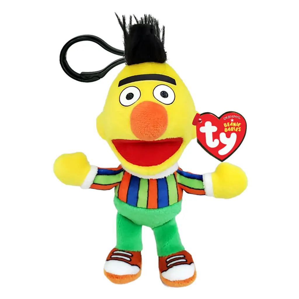Sesame Street Bert plush clip in yellow soft fabric, with black hair, orange nose, striped shirt, green pants and orange shoes, shown with a TY Beanie Babies tag on white.