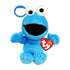 Sesame Street Cookie Monster plush clip in bright blue fuzzy fabric, with large white eyes, black open mouth, wide arms and seated form, shown with a TY Beanie Babies tag on white.